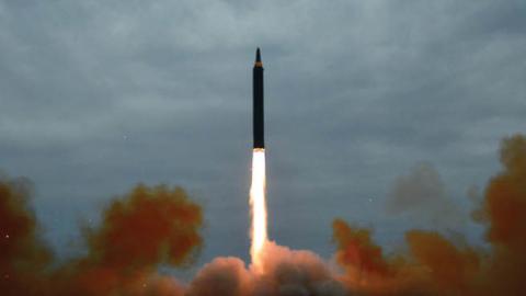 North Korea's intermediate-range strategic ballistic rocket Hwasong-12 lifting off from the launching pad at an undisclosed location near Pyongyang (STR/AFP via Getty Images)