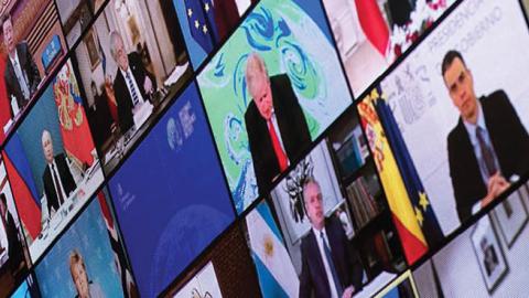 Vladimir Putin, Xi Jinping, Turkey's President  Erdogan, UK Prime Minister Boris Johnson, and President Joe Biden are seen on a screen during a climate change virtual summit (Photo by BRENDAN SMIALOWSKI/AFP via Getty Images)