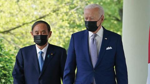 US President Joe Biden and Japan's Prime Minister Yoshihide Suga walk through the Colonnade to take part in a joint press conference in the Rose Garden of the White House in Washington, DC on April 16, 2021 (Photo by MANDEL NGAN/AFP via Getty Images)