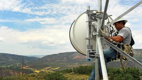 A tower technician for Advanced Wireless Solutions works to make repairs on the dish on the Pollard cell tower in rural Rio Blanco County near Meeker, Colorado (Photo by Helen H. Richardson/MediaNews Group/The Denver Post via Getty Images)