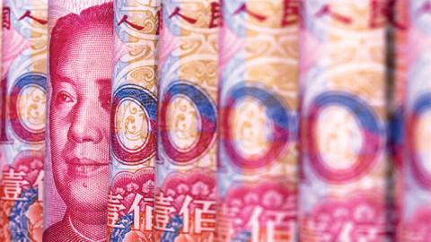 Chinese RMB banknotes are arranged for a photograph (Photo by Zhang Peng/LightRocket via Getty Images)
