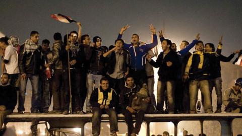 Egyptian anti-government protesters celebrate at Tahrir Square in Cairo on February 11, 2011 after President Hosni Mubarak stepped down after three decades of autocratic rule and handed power to a junta of senior military commanders (Getty Images)