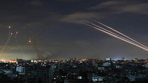 Israel's Iron Dome missile defence system intercepts rockets fired by the Hamas movement from Gaza city towards Israel early on May 16, 2021 (Photo by MOHAMMED ABED/AFP via Getty Images)