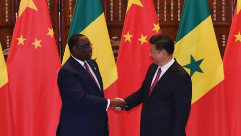 Chinese President Xi Jinping (R) shakes hands with Senegalese President Macky Sall (L) during a meeting at the West lake State Guest House in Hangzhou, Zhejiang Province on September 2, 2016 (IWASAKI MINORU/AFP via Getty Images)