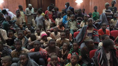 Released students gather at the Government House with other students from the Government Science Secondary school, in Kankara, in northwestern Katsina State, Nigeria upon their release on December 18, 2020 (Photo by KOLA SULAIMON/AFP via Getty Images)