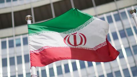 The flag of Iran is seen in front of the building of the International Atomic Energy Agency (IAEA) Headquarters ahead of a press conference by Rafael Grossi, Director General of the IAEA, about the agency's monitoring of Iran's nuclear energy program on M