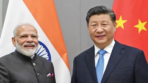 Chinese President Xi Jinping meets with Indian Prime Minister Narendra Modi in Brasilia, Brazil, Nov. 13, 2019. (Photo by Zhang Ling/Xinhua via Getty Images)