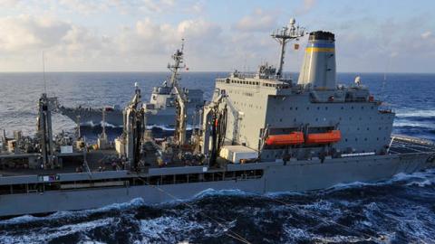 The amphibious assault ship USS Wasp (LHD 1) conducts a replenishment-at-sea with the fleet replenishment oiler USNS Tippecanoe (T-AO 199) and the Arleigh Burke-class guided missile destroyer USS Dewey (DDG 105) (U.S. Navy Photo)