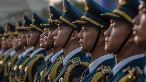 Members of a People's Liberation Army band stand together at a ceremony marking the 100th anniversary of the Communist Party on July 1, 2021 at Tiananmen Square in Beijing, China. (Photo by Kevin Frayer/Getty Images)