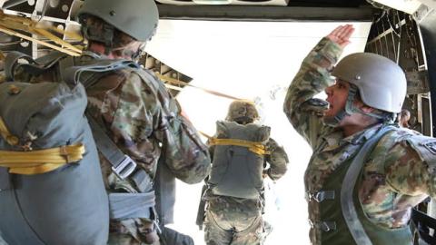 A Jumpmaster from the U.S. Army John F. Kennedy Special Warfare Center and School instructs Soldiers to exit a CASA C-212 Aviocar aircraft to jump over Laurinburg-Maxton Airfield March 28, 2019 (U.S. Army photo by K. Kassens)