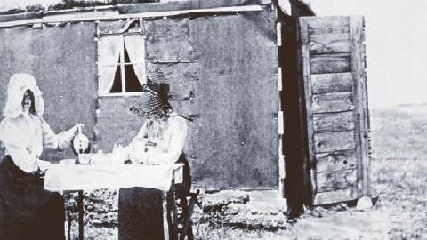 Mina Westbye, left, at her homestead ‘villa’ in North Dakota, ca. 1905.