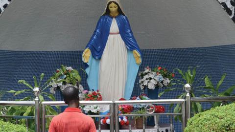 A man prays at Mary Grotto at St Leo Church, Ikeja, Lagos. Members of St. Leo Catholic Church, Ikaja in Lagos Nigeria, dramatize the Station of the Cross, suffering and death of Jesus Christ on Good Friday, April 14 2017 (Photo by Adekunle Ajayi/NurPhoto 