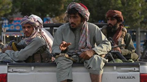 Taliban fighters in a vehicle patrol the streets of Kabul on August 23, 2021 (Photo by WAKIL KOHSAR/AFP via Getty Images)