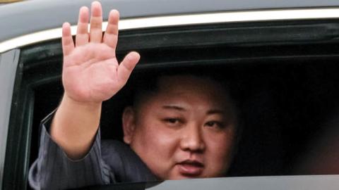 Kim Jong-un waves from his car after arriving by train at Dong Dang railway station near the border with China on February 26, 2019 in Lang Son, Vietnam (Photo by Linh Pham/Getty Images)