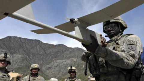 A U.S. soldier prepares an RQ-11 Raven miniature unmanned aerial vehicle during a mission in Nishagam, Afghanistan. (Liu Jin/AFP via Getty Images)