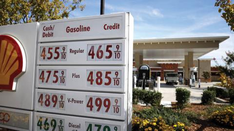 Gas prices approaching $5 a gallon are displayed in front of a Shell gas station on October 05, 2021 in San Rafael, California. (Photo by Justin Sullivan/Getty Images)
