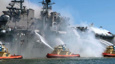 Sailors and Federal Firefighters combat a fire onboard USS Bonhomme Richard (LHD 6) at Naval Base San Diego, July 12. (U.S. Navy photo by Mass Communication Specialist 3rd Class Christina Ross)