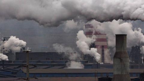 Smoke billows from smokestacks and a coal fired generator at a steel factory on November 19, 2015 in the industrial province of Hebei, China. (Photo by Kevin Frayer/Getty Images)