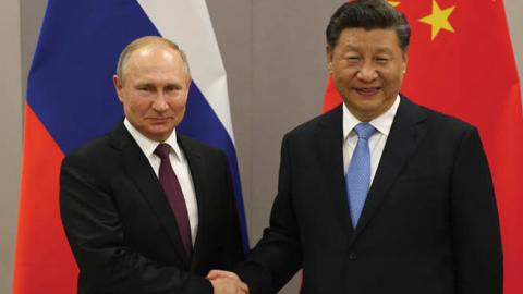 Russian President Vladimir Putin and Chinese President Xi Jinping during their bilateral meeting on November 13, 2019 in Brasilia, Brazil. (Photo by Mikhail Svetlov/Getty Images)