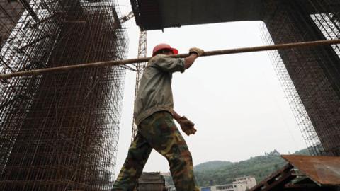 A worker at a construction site of a new bridge project on June 20, 2009 in Guiyang of Guizhou Province, China. (Photo by Wu Dongjun/Visual China Group via Getty Images)
