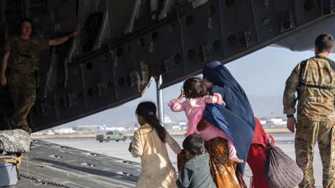 Passengers are loaded aboard a U.S. Air Force C-17 in Kabul, Afghanistan. (Master Sgt. Donald R. Allen/U.S. Air Forces Europe-Africa via Getty Images)