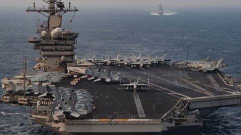 The aircraft carrier USS Nimitz steams ahead of the guided-missile cruiser USS Princeton during Malabar 2020 exercises in the north Arabian Sea, November 17, 2020. (US Navy)