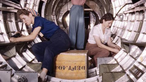 Women workers install fixtures and assemblies to a tail fuselage section of a B-17 bomber at the Douglas Aircraft Company plant, Long Beach, California in 1942. (Photo by Buyenlarge/Getty Images)