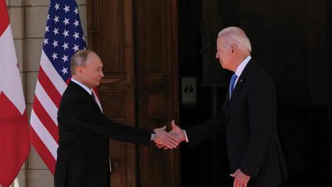 Russian President Vladimir Putin shakes hands with U.S. President Joe Biden during their meeting in Geneva on June 16, 2021. (Photo by Alexander Zemlianichenko/Pool/AFP via Getty Images)