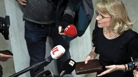MP of the Finland's Christian Democrats Paivi Rasanen holds a bible as she speaks to media ahead of a court session at the Helsinki District Court in Helsinki, Finland on January 24, 2022. (Photo by Antti Aimo-Koivisto/AFP via Getty Images)