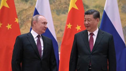 Russian President Vladimir Putin and Chinese Leader Xi Jinping pose during their meeting in Beijing, on February 4, 2022. (Photo by Alexei Druzhinin/Sputnik/AFP via Getty Images)