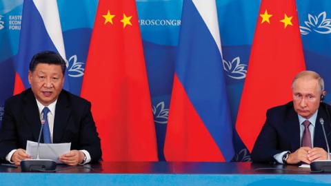 Russian President Vladimir Putin and his Chinese counterpart Xi Jinping make a statement to the press following their talks on the sidelines of the Eastern Economic Forum in Vladivostok on September 11, 2018. (Sergei Chirikov/AFP via Getty Images)
