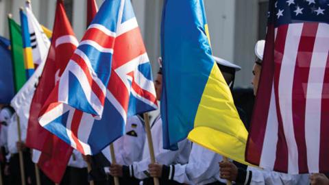 Ukrainian navy sailors hold the flags of participating countries in Exercise Sea Breeze 2021 in Odesa, Ukraine, July 4, 2021. (U.S. Navy)