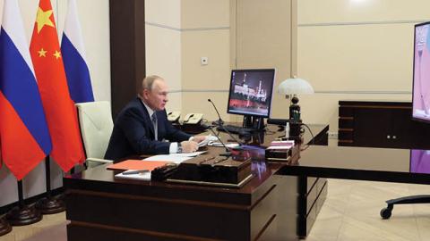 Russian President Vladimir Putin holds a meeting with Chinese President Xi Jinping via a video link at the Novo-Ogaryovo state residence outside Moscow on December 15, 2021. (Photo by Mikhail Metzel/Sputnik/AFP via Getty Images)
