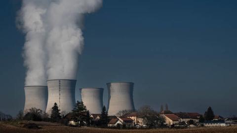 Water vapor rising from chimneys of the Bugey nuclear power plant on January 25, 2022, in Saint-Vulbas, France. (Photo by Jean-Philippe Ksiazek/AFP via Getty Images)