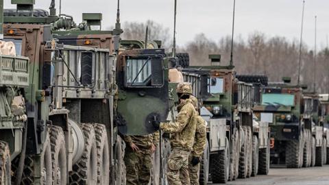 U.S. Army vehicles on the grounds of the Grafenwoehr military training area in Bavaria on February 9, 2022. (Photo by Armin Weigel via Getty Images)