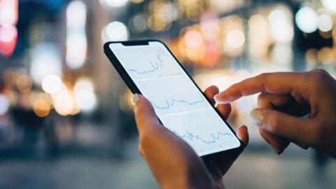 Financial data displayed on a smartphone. (Getty Images)