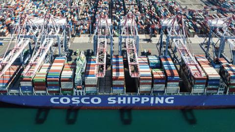 Aerial view of a container ship of COSCO shipping unloading cargoes at the Port of Los Angeles on October 26, 2021 in San Pedro, California. (Photo by Qian Weizhong/VCG via Getty Images)