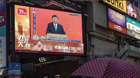 Xi Jinping speaks during a news conference, displayed on a television screen at a shopping area on June 30, 2022, in Hong Kong. (Photo by Anthony Kwan/Getty Images)