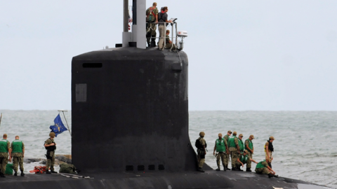 Crew members are seen on the USS Indiana, a nuclear powered United States Navy Virginia-class fast attack submarine, as it departs Port Canaveral in Florida on October 1, 2018. (Photo by Paul Hennessy/NurPhoto via Getty Images)