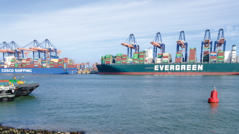 The Taiwanese container ship Ever Greet next to a vessel of China's state owned COSCO shipping company in the Rotterdam harbor on March 2, 2022. (Photo by Thierry Monasse/Getty Images)