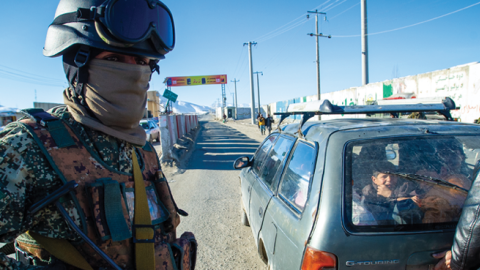  Taliban fighters check vehicles and passengers at a security checkpoint on January 14, 2022, in Kabul, Afghanistan. (Photo by Scott Peterson/Getty Images) 
