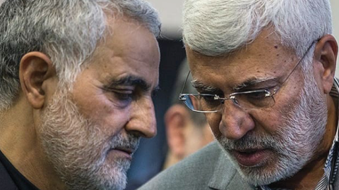 Qasem Soleimani with Abu Mahdi al-Muhandis at a 2017 ceremony commemorating the father of Soleimani, in Musalla, Tehran. (Fars Media Corporation via Wikimedia Commons)