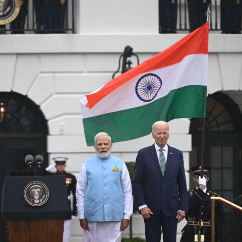 US President Joe Biden and India's Prime Minister Narendra Modi listen to the national anthems during a welcoming ceremony for Modi on the South Lawn of the White House in Washington, DC, on June 22, 2023. (Andrew Caballero-Reynolds/AFP via Getty Images)