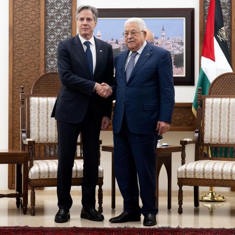 Palestinian Authority President Mahmud Abbas and US Secretary of State Antony Blinken shake hands prior to a meeting at the Muqata, the presidential compound in the West Bank city of Ramallah, on November 30, 2023. (Photo by Saul Loeb/Pool/AFP via Getty Images)