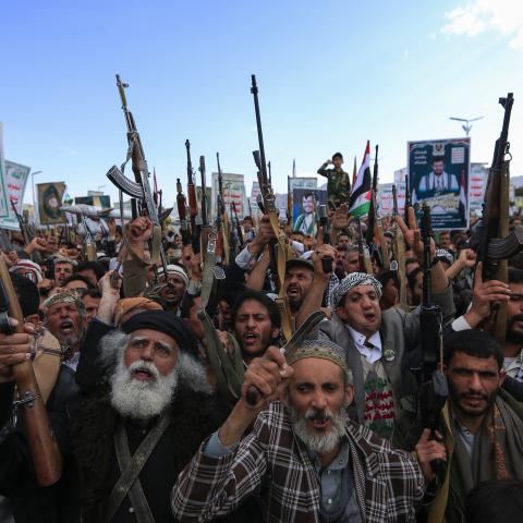 Yemenis brandish rifles and chant during a demonstration called for by the rebel Houthi movement in Sanaa on March 17, 2025. (Mohammed Huwais / AFP via Getty Images)