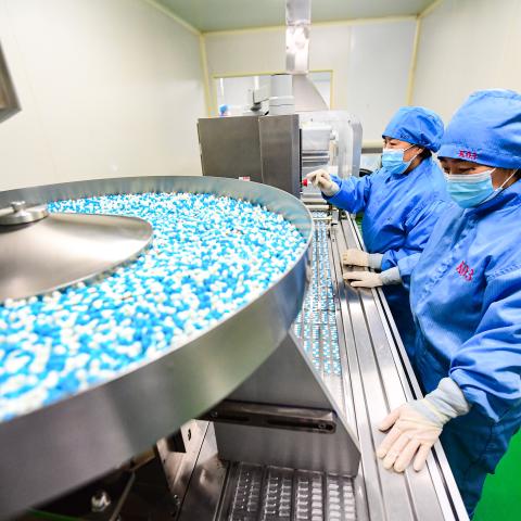 Employees work on the production line of medicine, at a factory, on January 12, 2023, in Shenyang, Liaoning Province of China. (VCG/VCG via Getty Images)
