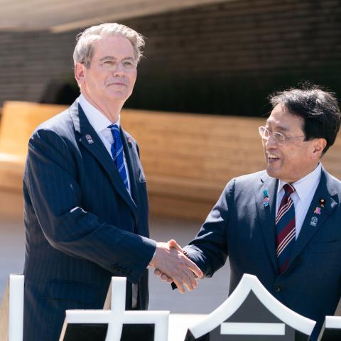 US Treasury Secretary Scott Bessent and Japan’s Minister of State for Economic and Fiscal Policy Ryosei Akazawa shake hands during a photo session as they arrive at the USA Pavilion on US National Day at the World Expo 2025 on July 19, 2025, in Osaka, Japan. (Tomohiro Ohsumi via Getty Images)