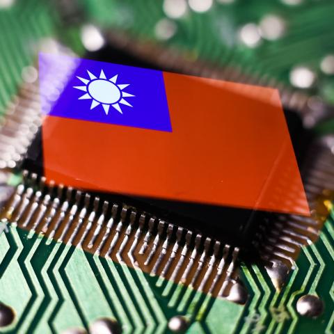 A microchip and Taiwanese flag displayed on a phone screen are seen in this multiple exposure illustration photo on April 10, 2023. (Jakub Porzycki via Getty Images)