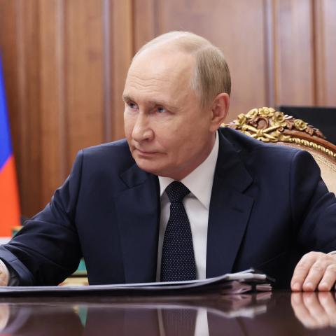 In this pool photograph distributed by the Russian state agency Sputnik, President Vladimir Putin meets with Moscow-installed head of the Donetsk region in Russian-controlled Ukraine, Denis Pushilin (not pictured), at the Kremlin in Moscow on August 4, 2025. (Mikhail Metzel via Getty Images)