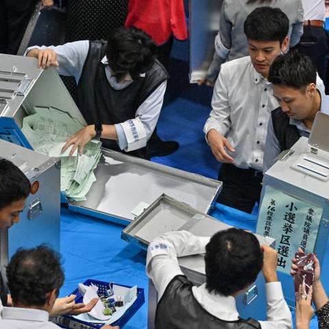Election administration officials open ballot boxes in Tokyo on October 27, 2024. (Getty Images)